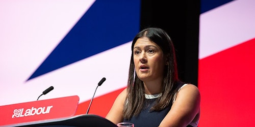 Lisa Nandy stadning before a Union Jack at a Labour event Lisa Nandy stadning before a Union Jack at a Labour event