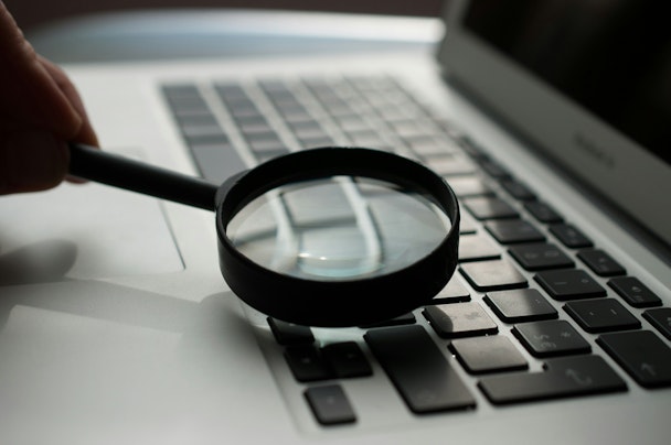 A magnifying glass on a laptop A magnifying glass on a laptop