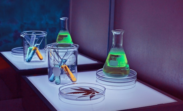 A set of science equipment lit up with green, blue and purple lights A set of science equipment lit up with green, blue and purple lights