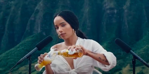 Zoe Kravitz pours a Michelob beer into a glass in front of two microphones in a still from a Super Bowl ad for the beer Zoe Kravitz pours a Michelob beer into a glass in front of two microphones in a still from a Super Bowl ad for the beer