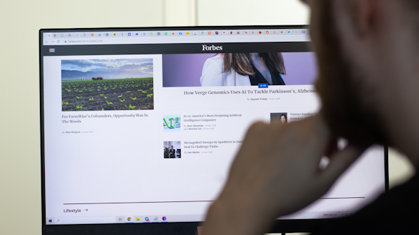 Man looking at Forbes.com Man looking at Forbes.com