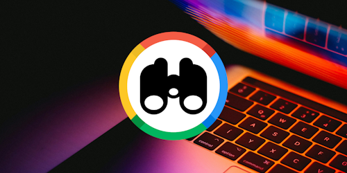 Binoculars with Google colors on background of laptop keyboard Binoculars with Google colors on background of laptop keyboard