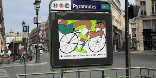 Illustration of a cyclist, created on an iPad, on an ad hoarding at the entrance of a Paris Metro station Illustration of a cyclist, created on an iPad, on an ad hoarding at the entrance of a Paris Metro station