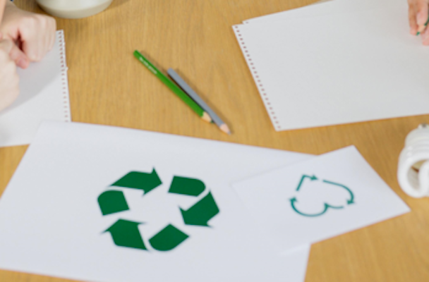 Recycling logo on a piece of paper Recycling logo on a piece of paper