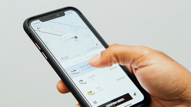Uber app open on man's mobile phone Uber app open on man's mobile phone