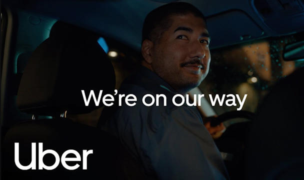 Uber driver with the words 'On our way' on top Uber driver with the words 'On our way' on top